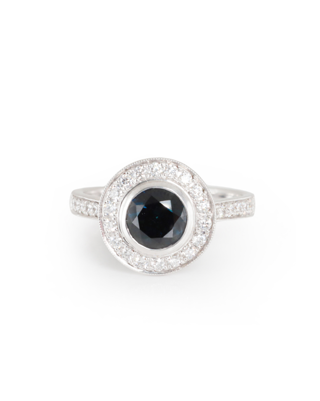 Austrialian round Sapphire with diamonds set in white gold, on a white background, Zappacosta Jewels