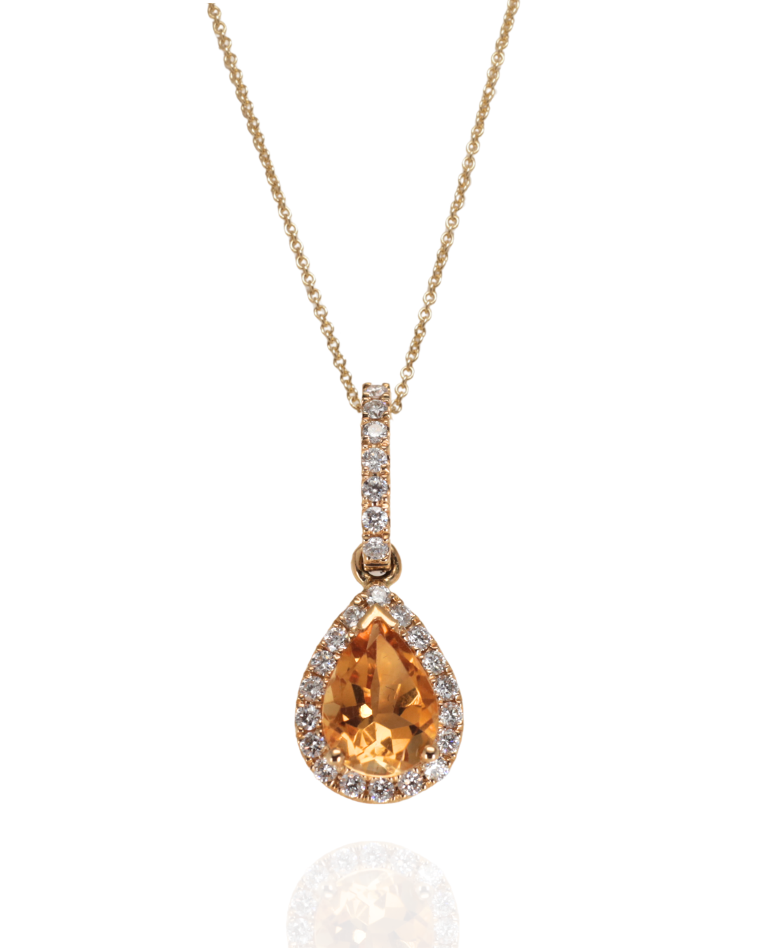 Teardrop-shaped Citrine pendant bordered with diamonds on a gold chain against a white background