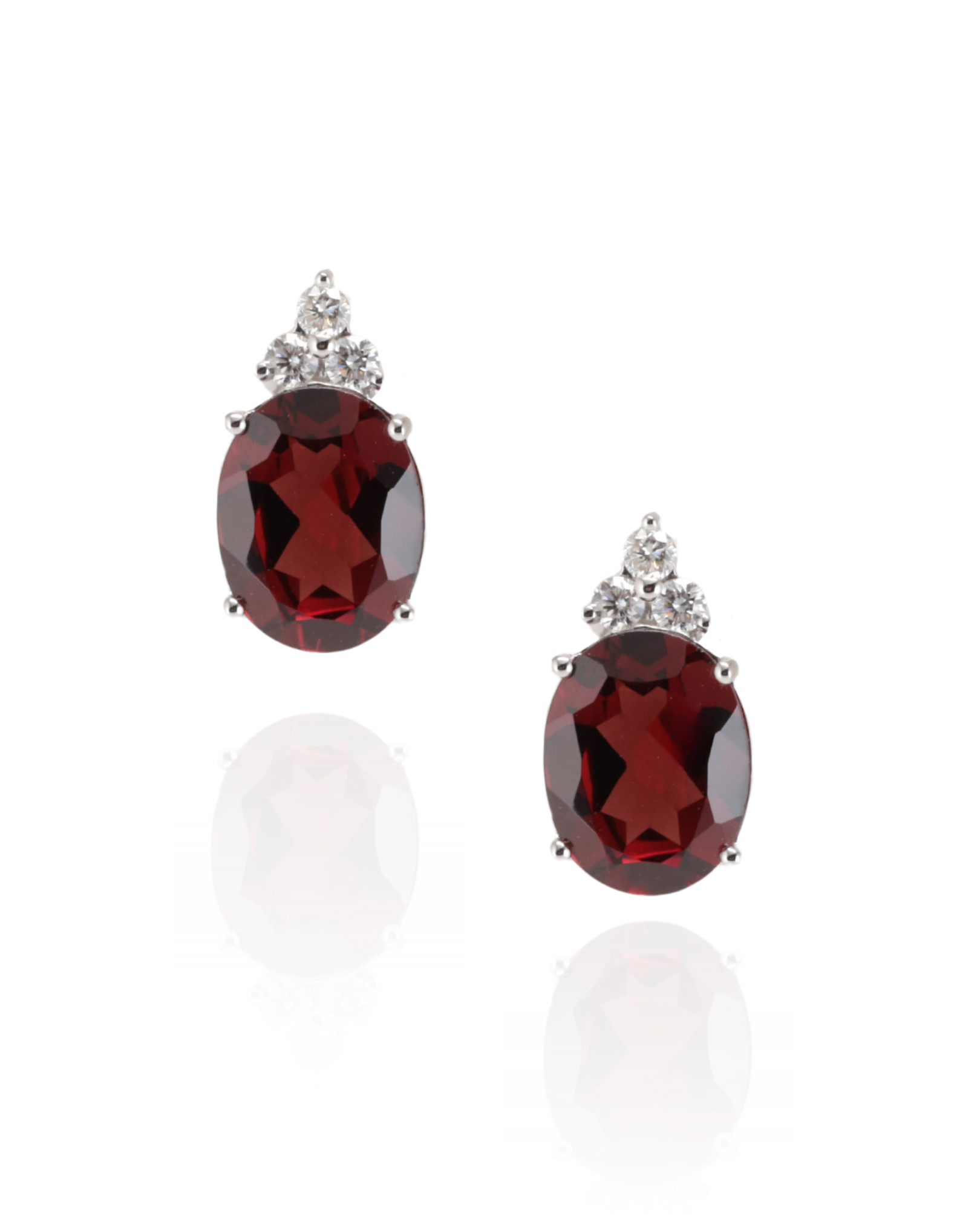 Pair of 18ct white gold earrings with a oval red Garnet gemstone with three 0.14ct diamonds north of the garnet, with butterfly backs on a white background. handcrafted in the heart of Sydney, Zappacosta Jewels 