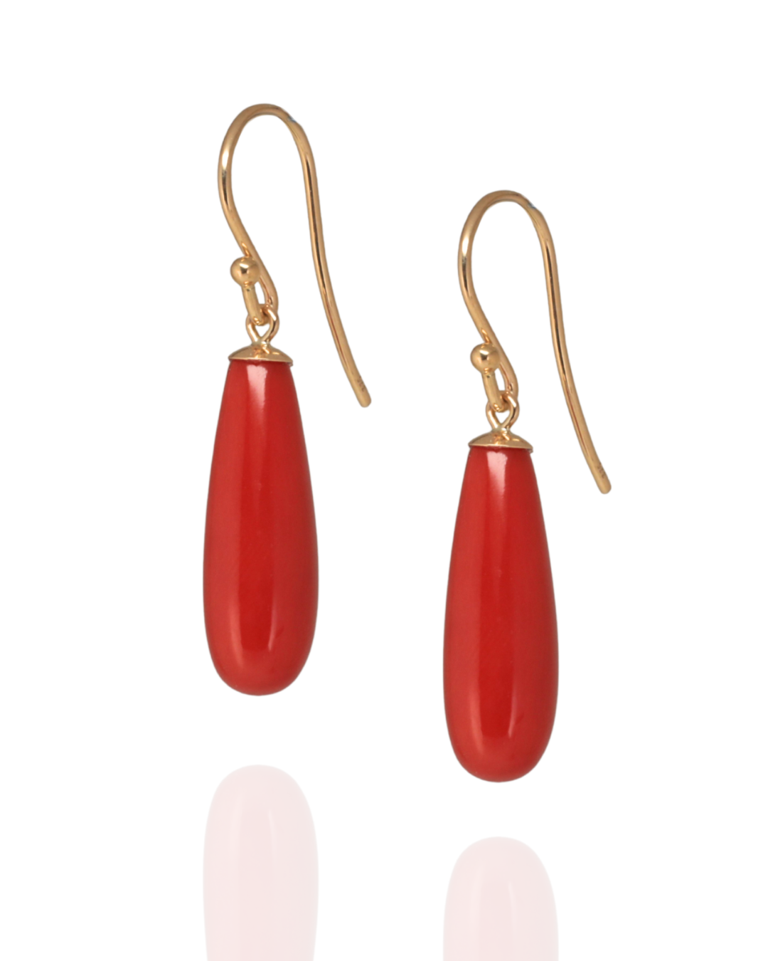 Mediterranean Red coral earrings suspended from yellow gold hooks on a white background
