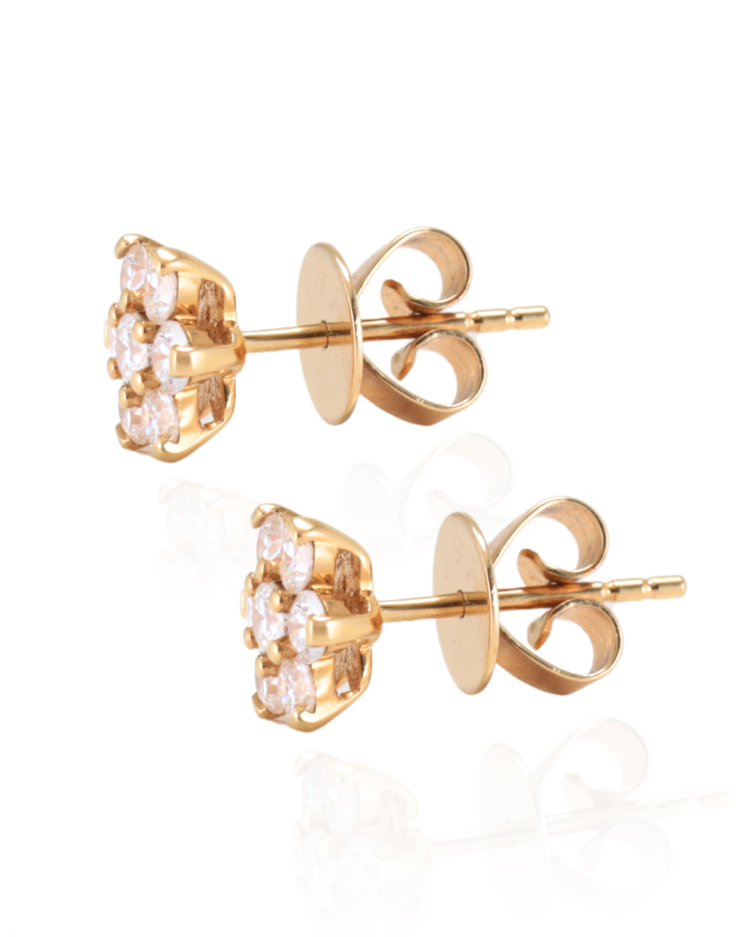 Pair of floral-shaped earrings with round cut natural Diamonds set in Yellow Gold studs on a white background, Zappacosta Jewels