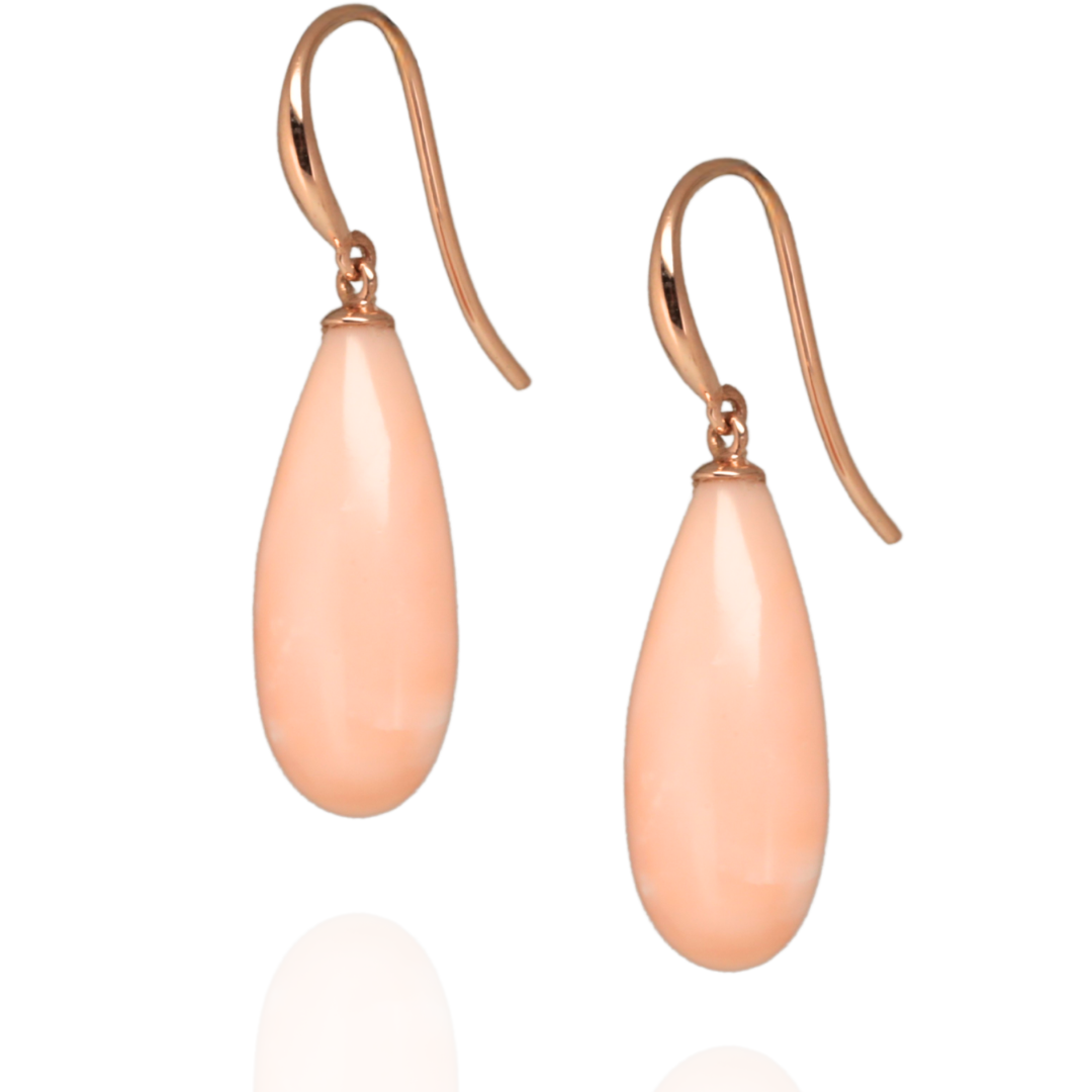 pair of pink pacific coral earrings suspended in rose gold hooks