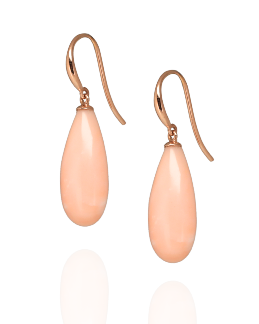 pair of pink pacific coral earrings suspended in rose gold hooks