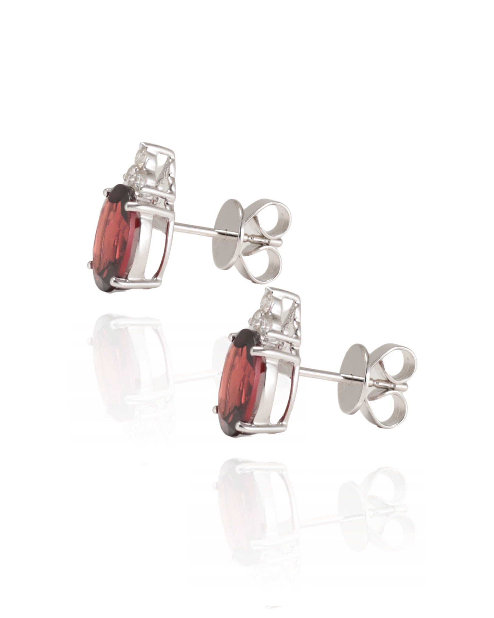 Pair of white gold stud earrings with red Garnet gemstones with natural Diamonds on a white background, side view with butterfly backs. Handcrafted in Sydney, Zappacosta Jewels 