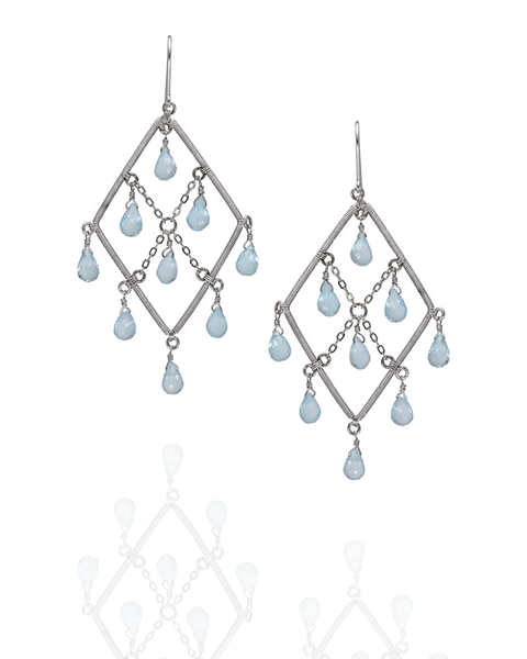 Pair of diamond-shaped earrings with teardrop-shaped beads on a white background