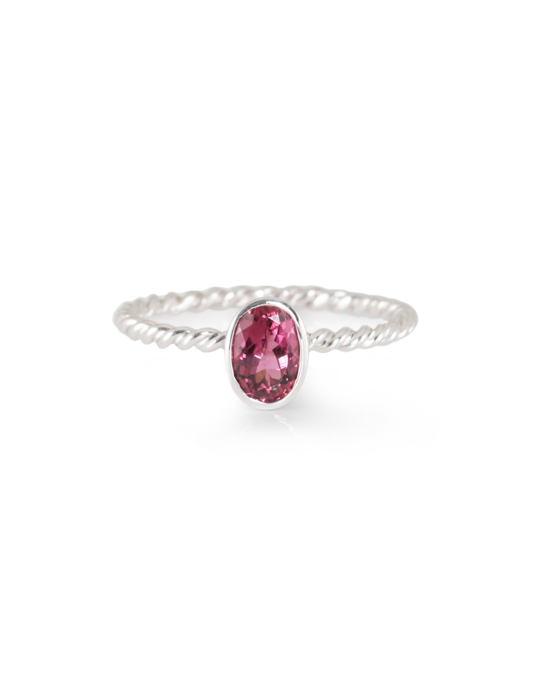 white gold ring with a pink  tourmaline woven band on a white background