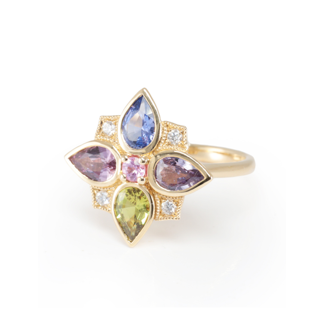 Multicolored Sapphire gemstone ring with  14ct yellow gold setting on a white background, a handcrafted custom design by Zappacosta Jewels 